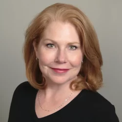 a woman smiling for the camera